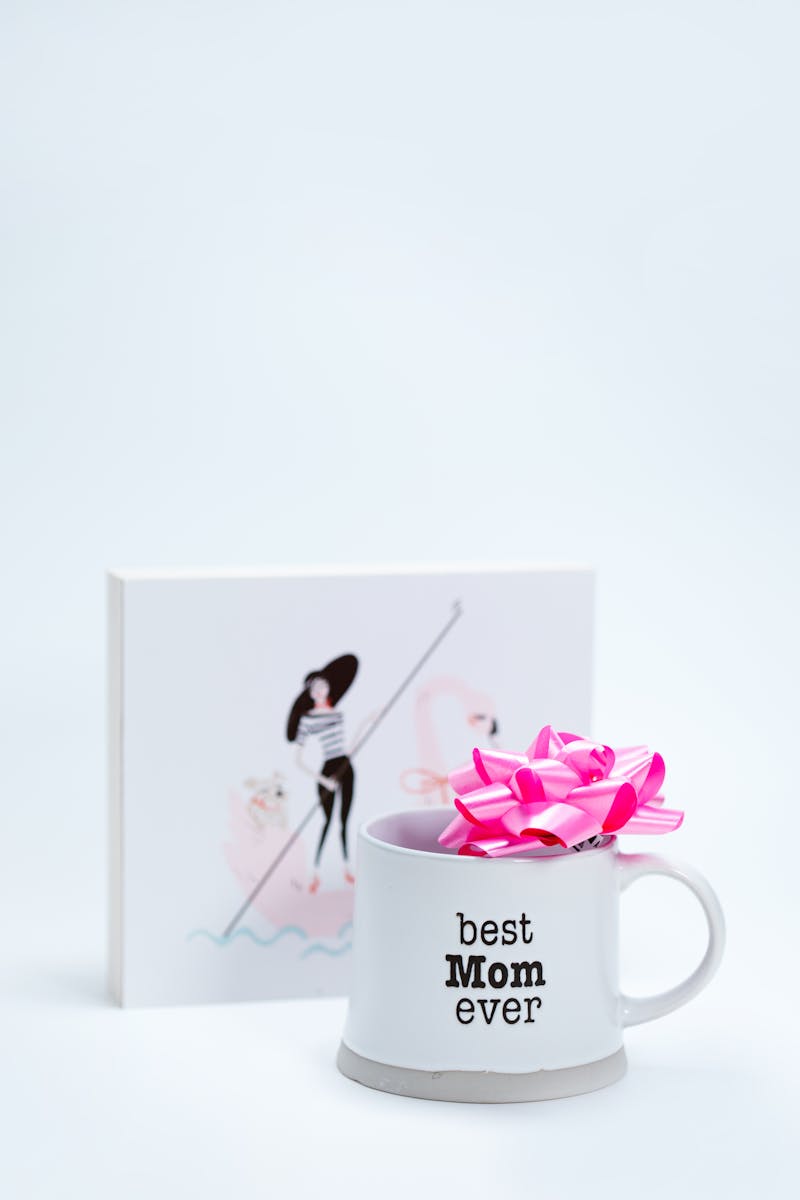 Charming ceramic mug with 'Best Mom Ever' text and pink bow, perfect for Mother's Day.